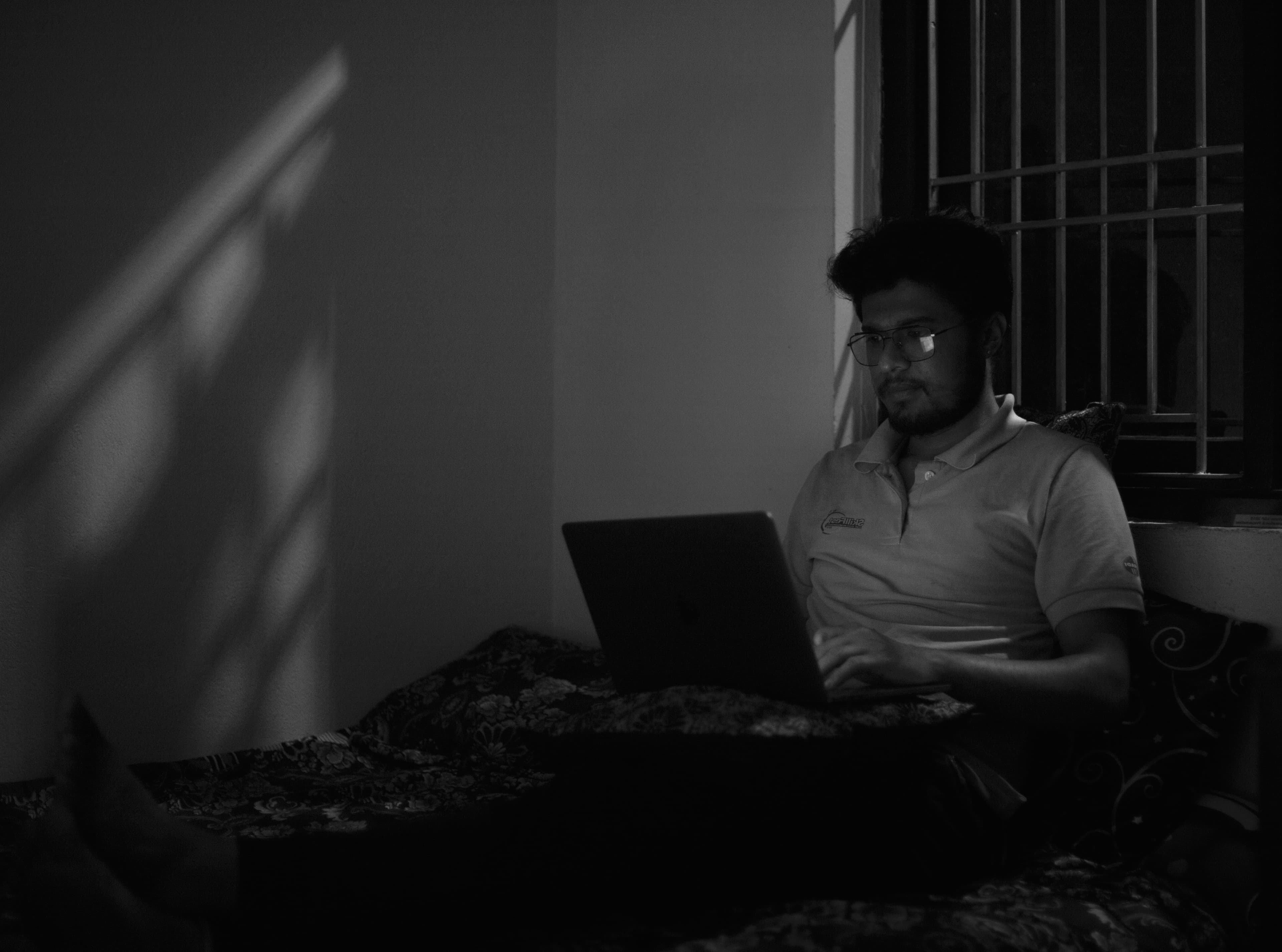 Ramesh Khatri working on a laptop